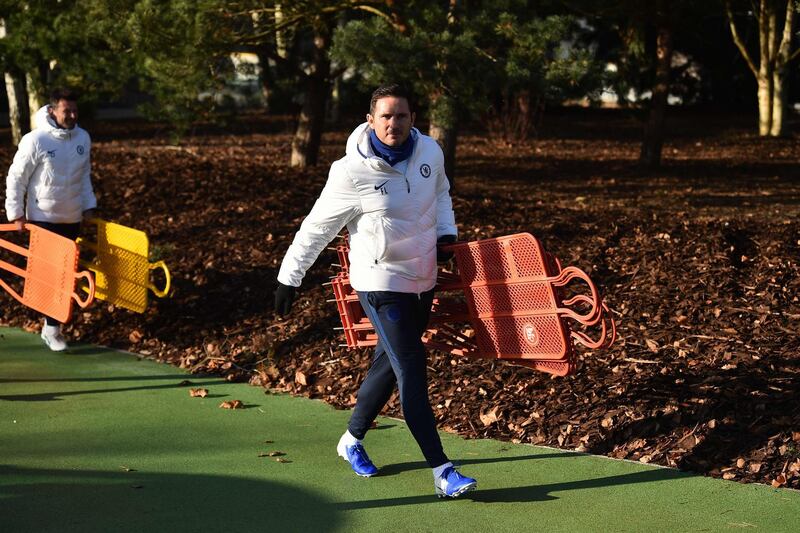 Chelsea coach Frank Lampard carries out free-kick mannequins for a training session on the eve of their Champions League Group H match against Lille. AFP