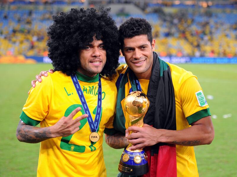 RIO DE JANEIRO, BRAZIL - JUNE 30:  Daniel Alves and Hulk (R) of Brazil celebrate with trophy after victory in the FIFA Confederations Cup Brazil 2013 Final match between Brazil and Spain at Maracana on June 30, 2013 in Rio de Janeiro, Brazil.  (Photo by Michael Regan/Getty Images) *** Local Caption ***  172028726.jpg
