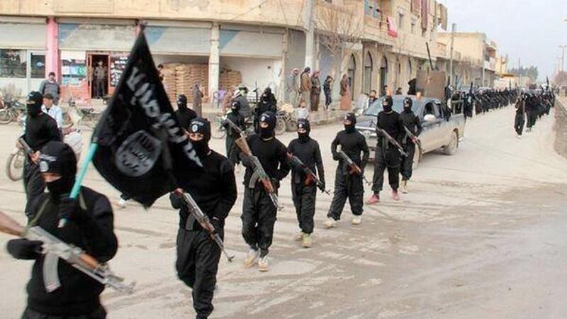 An undated photo from a militant website shows members of the Al Qaeda-linked Islamic State of Iraq and the Levant (ISIL) on the march in Raqqa, Syria. The group is increasingly attracting European recruits who believe the Muslim world is under siege, AP Photo

