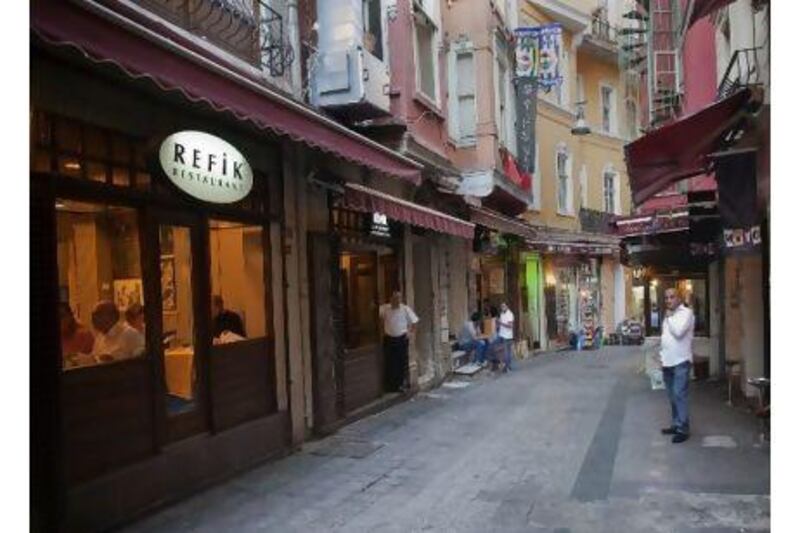 Before the clampdown, the streets outside the Refik restaurant in Istanbul would have been filled with tables - now they are empty. "There used to be 200 to 300 people here every day," says Mahmut Kaya, a kitchen worker. "Now we have 50 to 60." Kerem Uzel / NarPhotos for The National