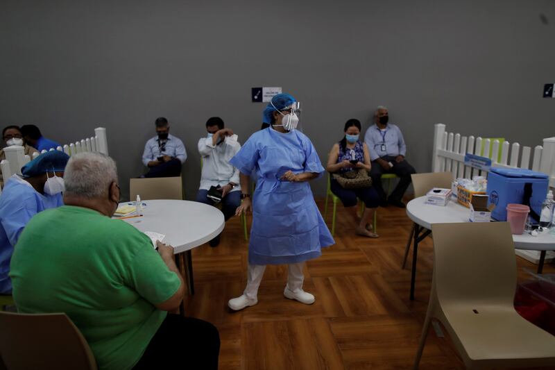 Medics take part in a vaccination session day in Panama City. EPA