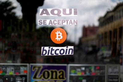 A sign, 'Bitcoin accepted here,, outside a shop in El Salvador. The country's adoption of Bitcoin as legal tender was another step towards mainstream acceptance of the digital currency. Reuters