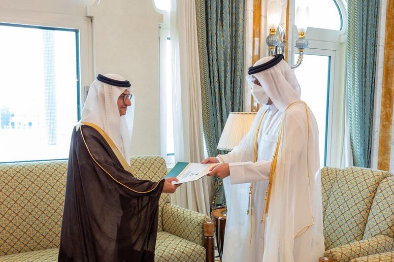 A handout picture released by the Qatar News Agency (QNA) shows Qatari Deputy Prime Minister and Minister of Foreign Affairs Sheikh Mohammed Bin Abdulrahman Al-Thani(R) receiving a copy of the credentials of the Ambassador of the Kingdom of Saudi Arabia Prince Mansour bin Khalid bin Farhan Al-Saud, in Doha on June 21, 2021.  RESTRICTED TO EDITORIAL USE - MANDATORY CREDIT "AFP PHOTO / QATAR NEWS AGENCY " - NO MARKETING NO ADVERTISING CAMPAIGNS - DISTRIBUTED AS A SERVICE TO CLIENTS
 / AFP / Qatar News Agency / - /  RESTRICTED TO EDITORIAL USE - MANDATORY CREDIT "AFP PHOTO / QATAR NEWS AGENCY " - NO MARKETING NO ADVERTISING CAMPAIGNS - DISTRIBUTED AS A SERVICE TO CLIENTS
