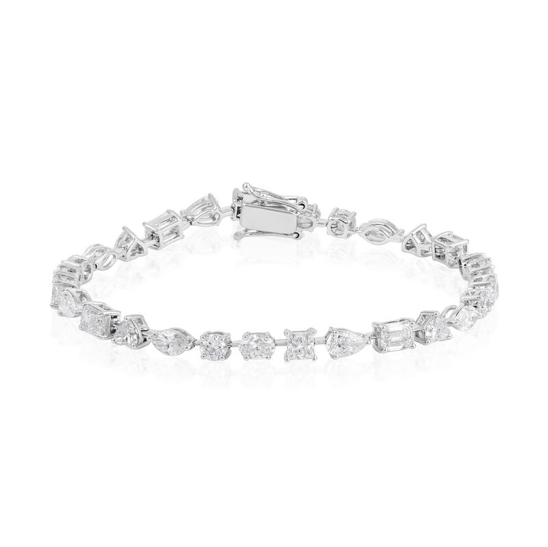 A bracelet from the Eternal Happiness collection that uses six diamond shapes sliced by a line of solid gold; Dh30,000, from Evermore Diamonds.