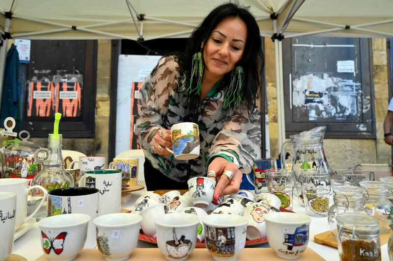 A woman displays merchandise for sale