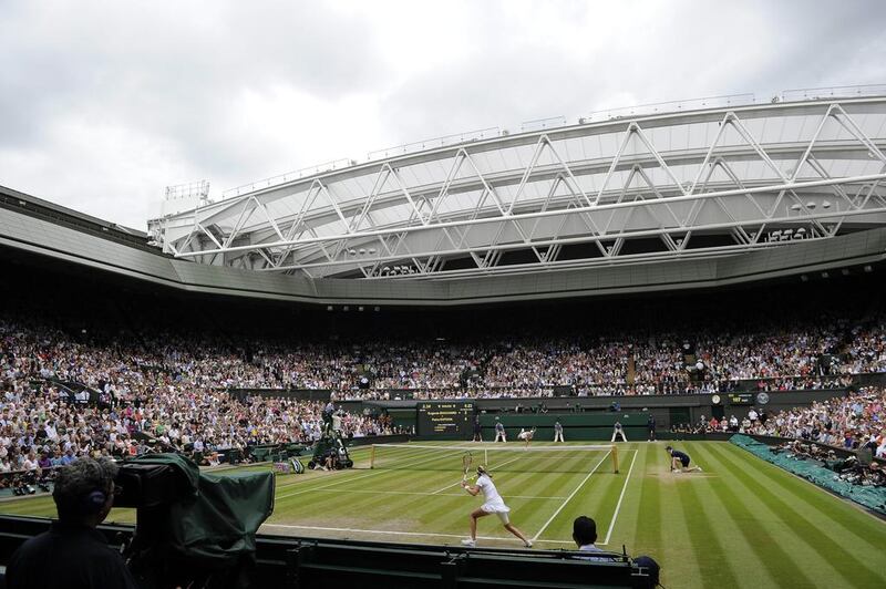 A general view of Centre Court at the All England Club on Saturday as Petra Kvitova plays Eugenie Bouchard in the women's singles final of the 2014 Wimbledon Championships. Facundo Arrizabalaga / EPA