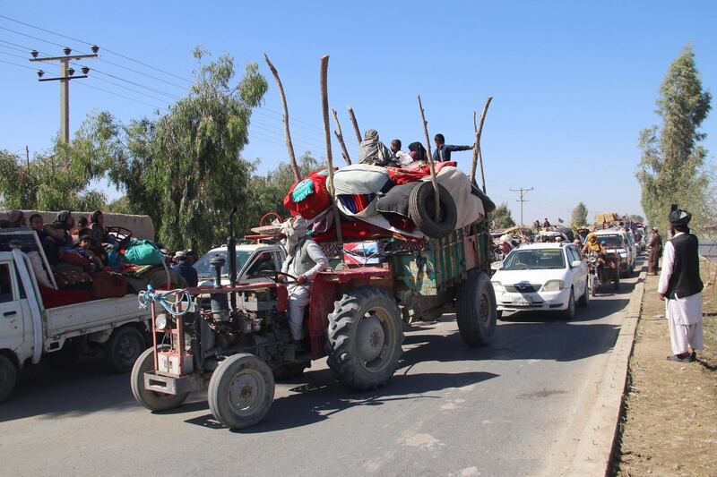 epa08737542 Afghans flee their villages after fighting intensified between Taliban militants and security forces, in Lashkargah, the provincial capital of restive Helmand province, Afghanistan, 12 October 2020. The clashes comes as both the Taliban and Afghan government are in the process of taking the peace talks forward in Doha, Qatar.  EPA/WATAN YAR