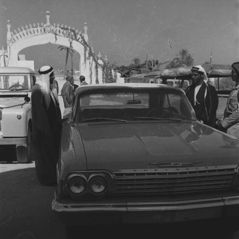 Archival photograph of the Trucial States shot by photographer Guy Gravett. This images shows Sheikh Zayed and Sultan at entance to a palace in 1962