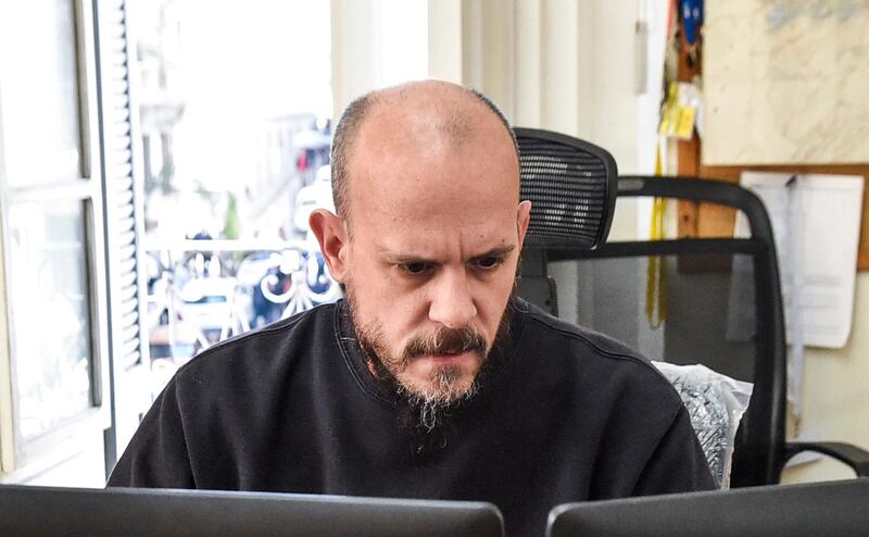Aymeric Vincenot, AFP's Algiers bureau chief, sits at his office in the capital Algiers on March 1, 2019. AFP bureau chief Aymeric Vincenot was expelled from Algeria on April 9 after the authorities refused to renew his press accreditation for 2019. Vincenot, 45, who has been in post in Algiers since June 2017, had to fly out of the country after his residency permit ran out and a final police deadline to leave expired. His expulsion comes amid political tensions in Algeria and weeks of unprecedented protests, which forced President Abdelaziz Bouteflika first to abandon his hopes of running for a fifth term and then to resign on April 2.    / AFP / -
