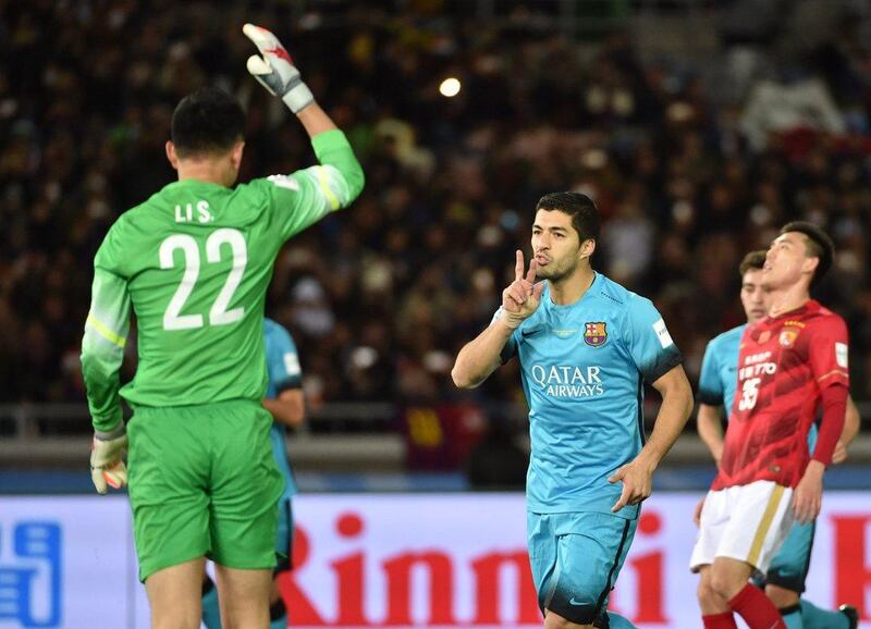 Barcelona forward Luis Suarez celebrates his goal against Guangzhou Evergrande. Kazuhiro Nogi / AFP