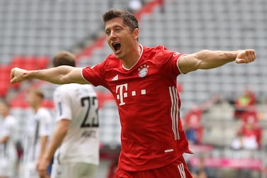 Bayern Munich's Robert Lewandowski celebrates after heading home the second goal against Freiburg. EPA