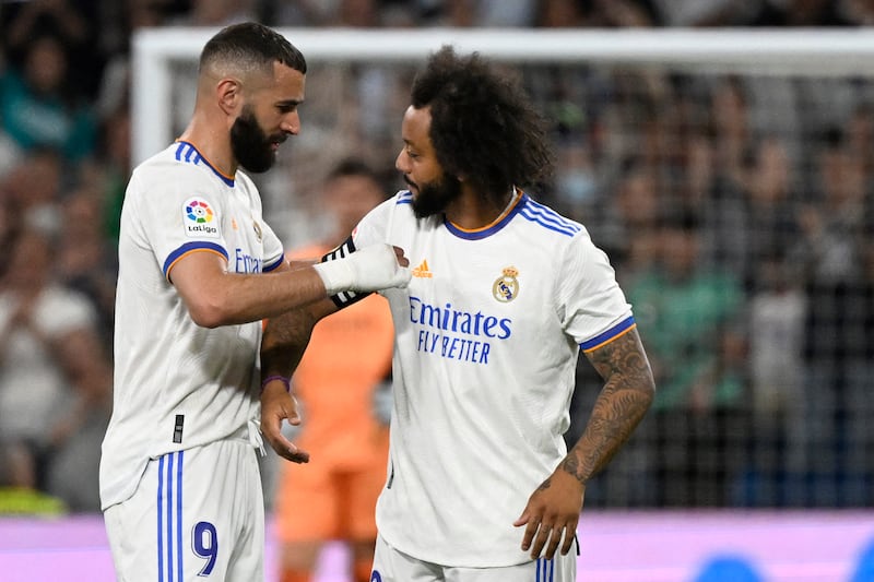 Real's Karim Benzema gives his captain's armband to Marcelo in what looks set to be the Brazilian's last game for the club. AFP