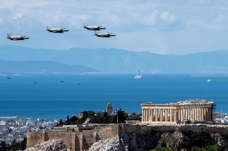Greek Air Force F4 aircraft fly over the Parthenon in Athens. AFP
