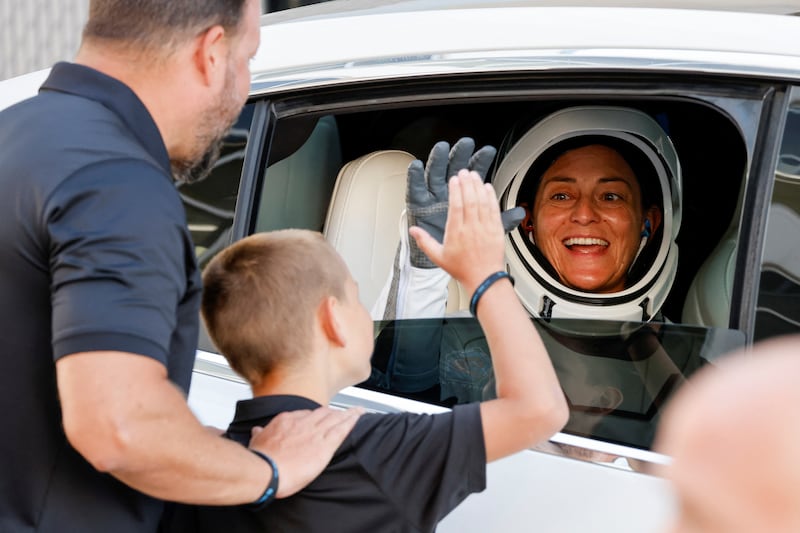 Commander Nicole Mann greets her family as she prepares to head to the launch pad in October 2022. Reuters