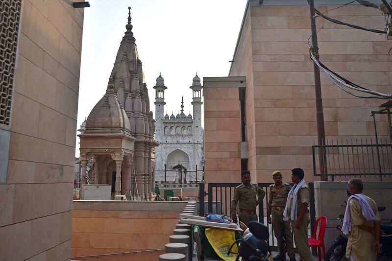 Policemen stand guard near Kashi Vishwanath Temple and the Gyanvapi Mosque in Varanasi. AFP