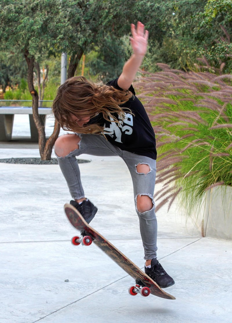 Abu Dhabi, United Arab Emirates, January 21, 2021.  Anabelle does some tricks on her scateboard at Al Fay Park on Reem Island.
Victor Besa/The National 
Section:  LF
Reporter: Panna Munyal