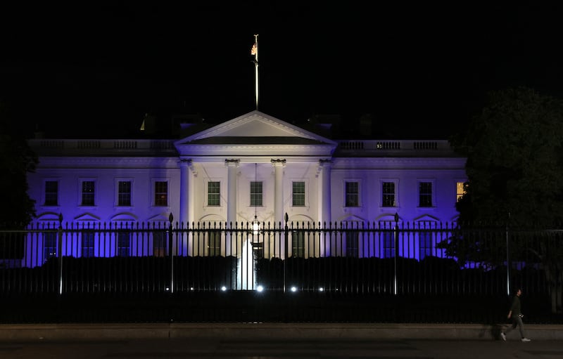 The White House is lit with the colours of the Israeli flag in Washington, on October 9. Reuters