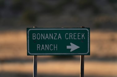 A sign stands near the Bonanza Creek Film Ranch in Santa Fe, N. M. , Saturday, Oct.  23, 2021.   An assistant director unwittingly handed actor Alec Baldwin a loaded weapon and told him it was safe to use in the moments before the actor fatally shot a cinematographer, court records released Friday show.   (AP Photo/Jae C.  Hong)