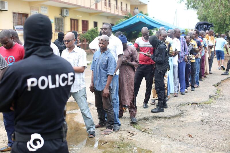 Police question detained Muslim retail traders on December 17, 2017 in Libreville, following a knife attack on two Danish nationals. 
Two Danish nationals were wounded December 16 in a knife attack in Gabon's capital apparently committed in retribution for "US attacks against Muslims", a rare assault in a Central African nation that has escaped Islamist violence. The two men, who were working for the National Geographic channel, were stabbed while shopping in a market popular with tourists, said defence minister Etienne Massard, adding that the attack appeared to be politically motivated. / AFP PHOTO / Steve JORDAN