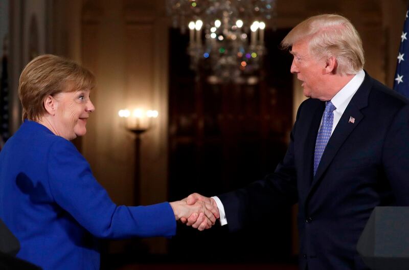 President Donald Trump shakes hands with German Chancellor Angela Merkel at the end of their news conference in the East Room of the White House, Friday, April 27, 2018, in Washington. Donald Trump and Emmanual Macron? Judging from the body language, mon ami! The president and Germanyâ€™s Angela Merkel? Ach, not so chummy. (AP Photo/Evan Vucci)