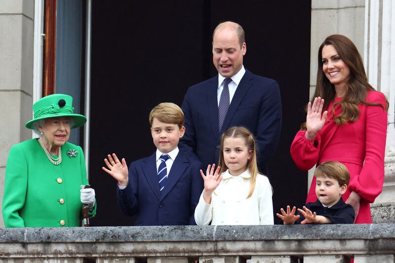 Queen Elizabeth II, Prince George, Princess Charlotte, Prince Louis, Prince William and his wife Kate wave from the balcony of Buckingham Palace at the end of the platinum pageant in London. AFP
