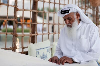 Muhammed Al Marzoogi shows the resilience of hand-made sails at Al Hosn Festival. Khushnum Bhandari / The National 