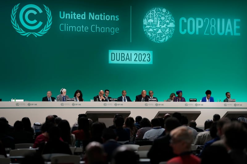 Sameh Shoukry, Cop27 President, centre, attends the opening session. AP