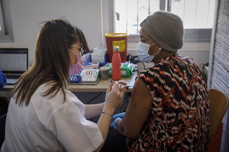 A foreign national receives a dose of the Pfizer-BioNTech Covid-19 vaccine at a vaccination centre in Tel Aviv. Bloomberg