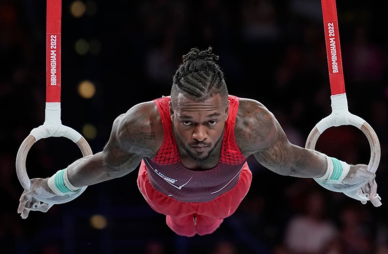 Courtney Tulloch of Team England during the men's rings finals at the Commonwealth Games in Birmingham, England.  Tulloch won the gold medal. AP