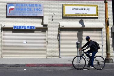 Closed shopfronts in what would be a normally busy fashion district in Los Angeles, California. The latest nonfarm payrolls report confirmed that 20.5 million Americans were out of work with the overall unemployment rate coming in at 14.7 per cent. AFP