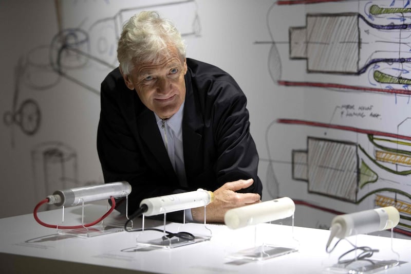 (FILES) In this file photo taken on October 11, 2018 Founder of the Dyson company, designer James Dyson, poses with products during a photo session at a hotel in Paris. British electric appliance pioneer Dyson will switch headquarters to Singapore this year due to booming Asian demand but not because of Brexit, the company said Tuesday, January 22, 2019. / AFP / Christophe ARCHAMBAULT
