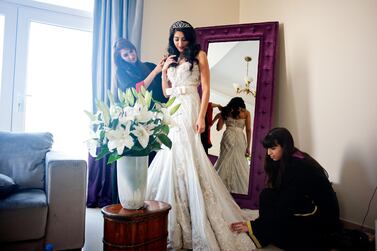 A bride on her wedding day. Brides in the Gulf tend to wear long, white gowns. Rich-Joseph Facun / arabianEye / Getty Images