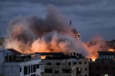 File photo: Smoke billows above buildings during an Israeli air strike on Gaza City, on May 20, 2021. AFP