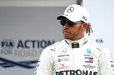 MELBOURNE, AUSTRALIA - MARCH 12: Lewis Hamilton of Great Britain and Mercedes GP looks on in the Paddock during previews ahead of the F1 Grand Prix of Australia at Melbourne Grand Prix Circuit on March 12, 2020 in Melbourne, Australia. (Photo by Clive Mason/Getty Images)