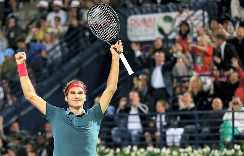 Roger Federer of Switzerland celebrates after defeating Tomas Berdych of Czech Republic during their final match in the ATP Dubai Duty Free Tennis Championships on March 1, 2014 in Dubai. Federer won his sixth Dubai Open title today with a 3-6, 6-4, 6-3 victory over Berdych. AFP PHOTO/KARIM SAHIB (Photo by KARIM SAHIB / AFP)