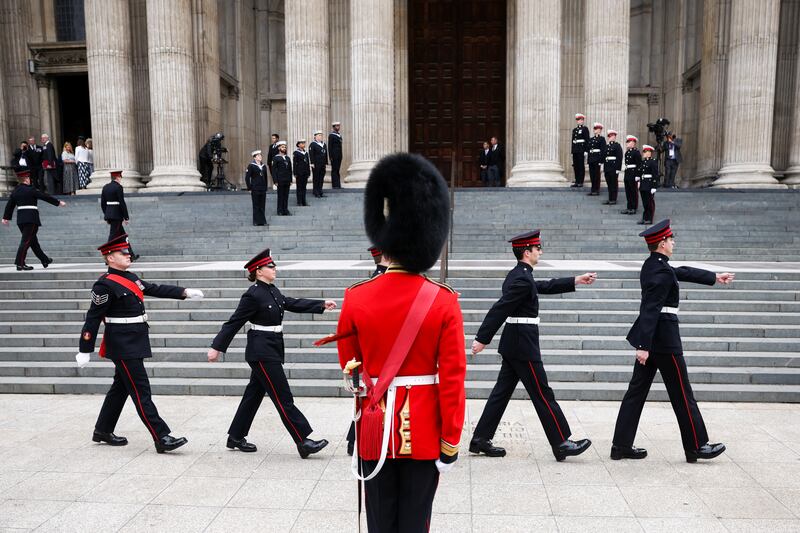 Members of the military march outside St Paul's Cathedral in the run-up to the thanksgiving service for the queen. Getty Images