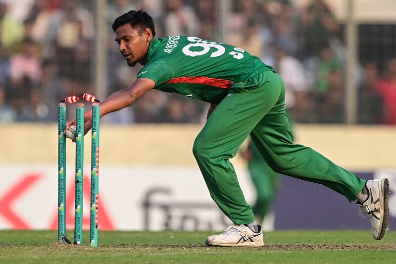 Bangladesh's Mustafizur Rahman runs out Jofra Archer of England for a duck. AFP