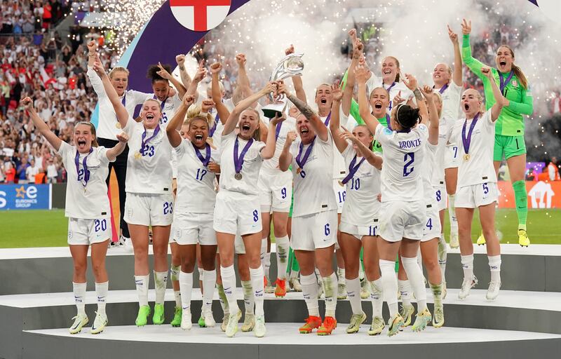 Leah Williamson and Millie Bright lift the trophy as England celebrate winning the Women's Euro 2022 final. PA