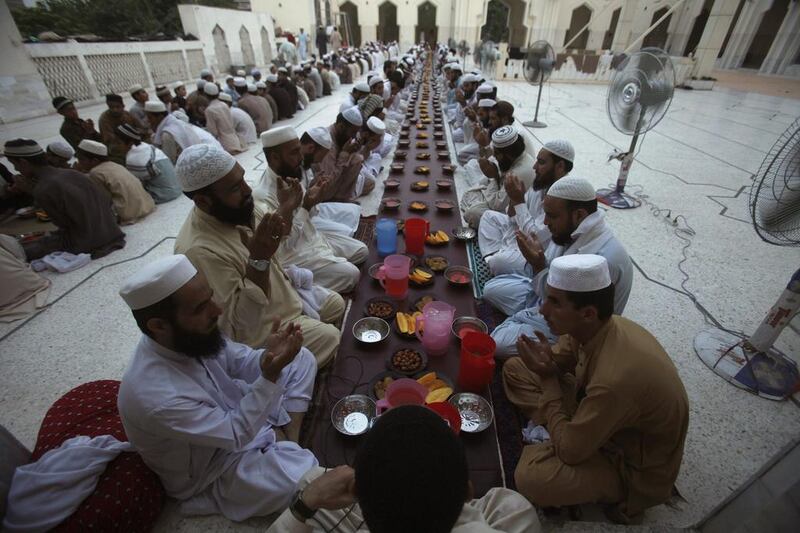 Men pray before breaking their fast on the first day of the holiest month in the Islamic calendar at a mosque in Peshawar, Pakistan on June 29, 2014. Fayaz Aziz/Reuters