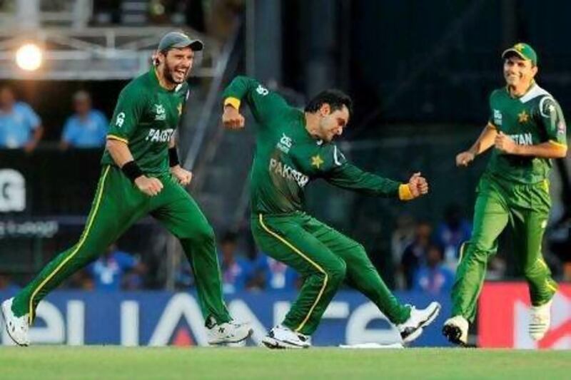 Mohammad Hafeez, centre, was confident Pakistan's bowlers were good enough to stop Australia. Hafeez himself took two wickets. Ishara S Kodikara / AFP