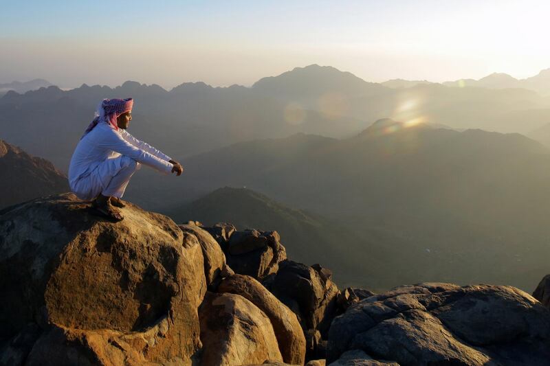 A Bedouin watches the sun rise outside a church on the top of Mount Sinai. EPA