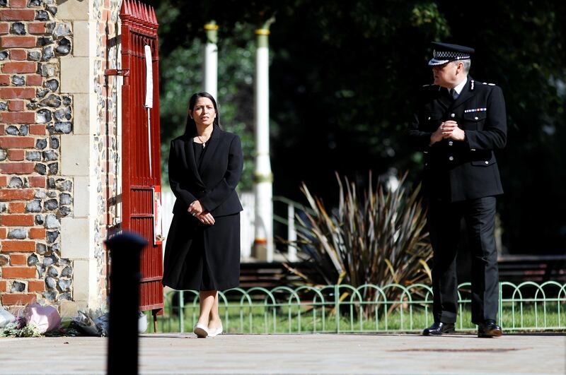 Britain's Home Secretary, Priti Patel, and Thames Valley Police Chief Constable, John Campbell are pictured near to the scene of reported multiple stabbings in Reading, Britain, June 22, 2020. REUTERS/Peter Nicholls