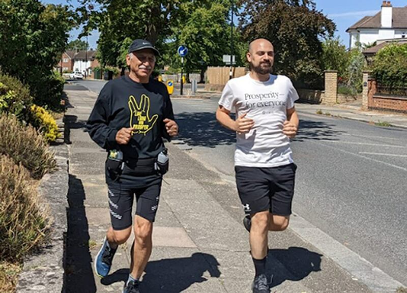 Anoosheh Ashoori and his son Aryan who will run in the London Marathon on Sunday. PA