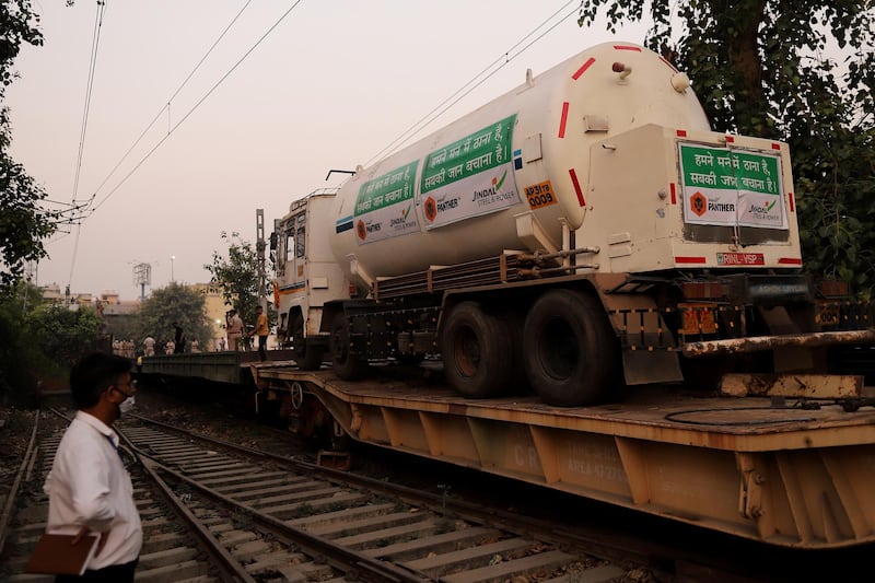 Medical oxygen tankers arrive at a train station in Delhi after being transported on a ‘Oxygen Express’ train. Bloomberg