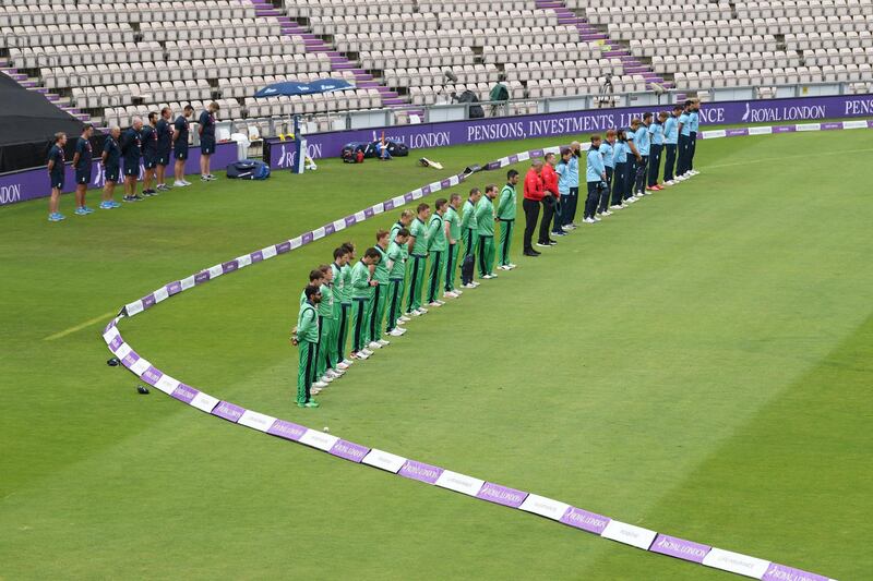 Cricketers and umpires observe a minute's silence for John Hume - a cricket fan - as play resumes behind closed doors following the outbreak of Covid-19 in Southampton on Tuesday. Reuters