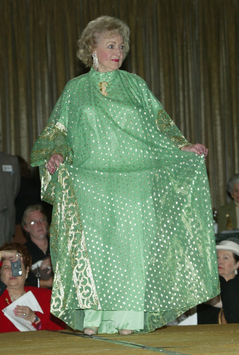 Betty White, in a green dress with gold detail, attends the Screen Smart Set Auxiliary of the Motion Picture & Television Fund event at the Regent Beverly Wilshire on October 8, 2003, in Beverly Hills, California. AFP