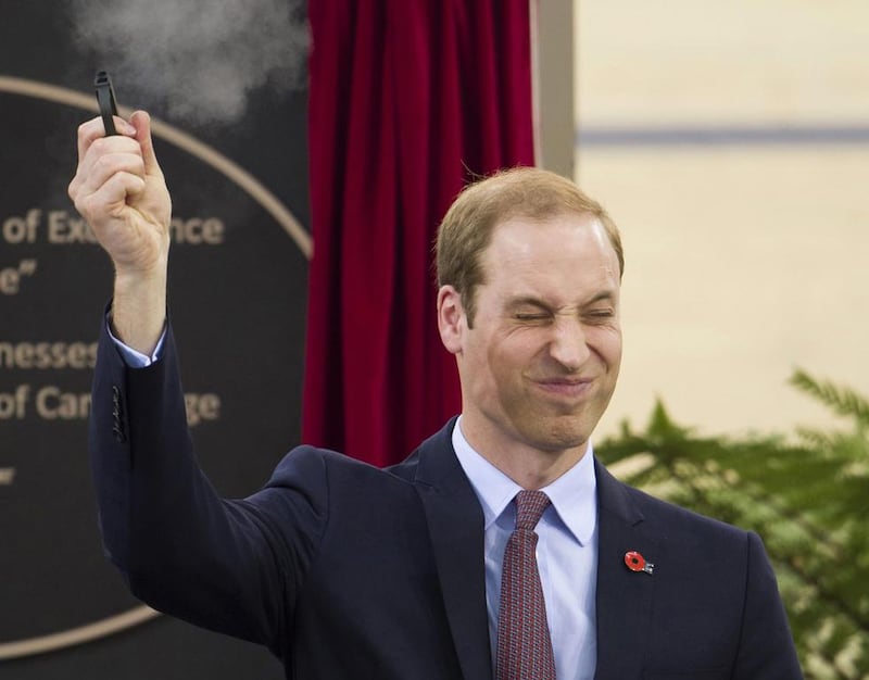 Britain’s Prince William fires a pistol to start a cycling race during a visit to open the new National Cycling Centre of Excellence in Cambridge. Tim Rooke / Reuters