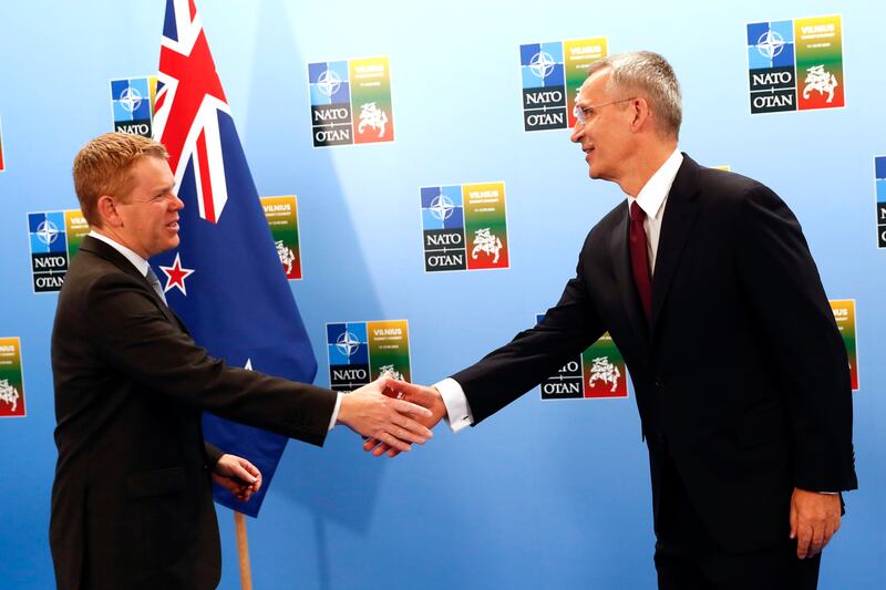 Mr Stoltenberg, right, greets New Zealand Prime Minister Chris Hipkins. AP