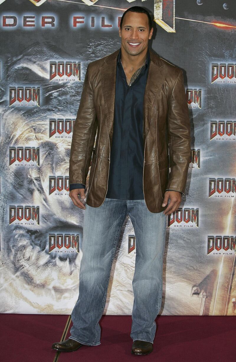 BERLIN - OCTOBER 24:  Actor Dwayne 'The Rock' Johnson smiles during a photo call for his newest movie "Doom" on October 24, 2005 in Berlin, Germany  (Photo by Andreas Rentz/Getty Images)