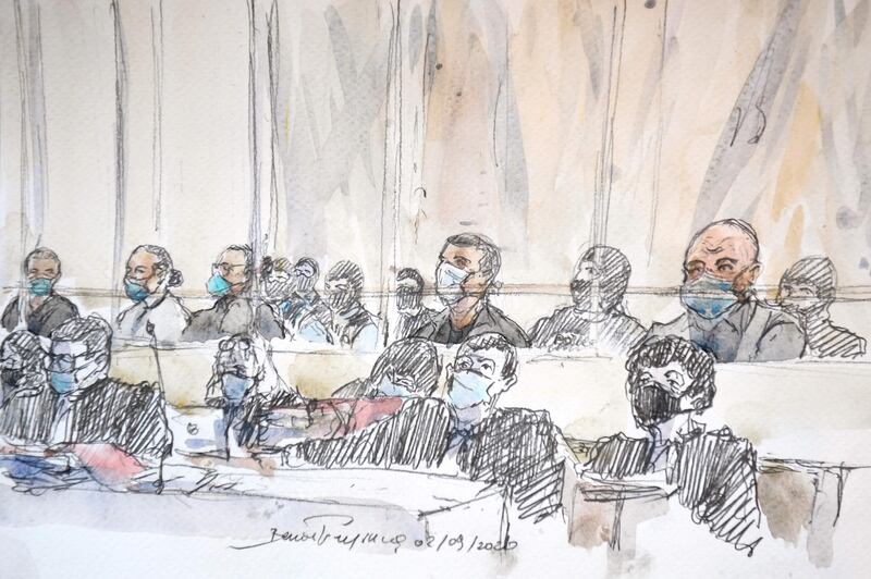 This court sketch made at the Paris courthouse shows the fourteen accused and their lawyers at the opening of the trial.  AFP